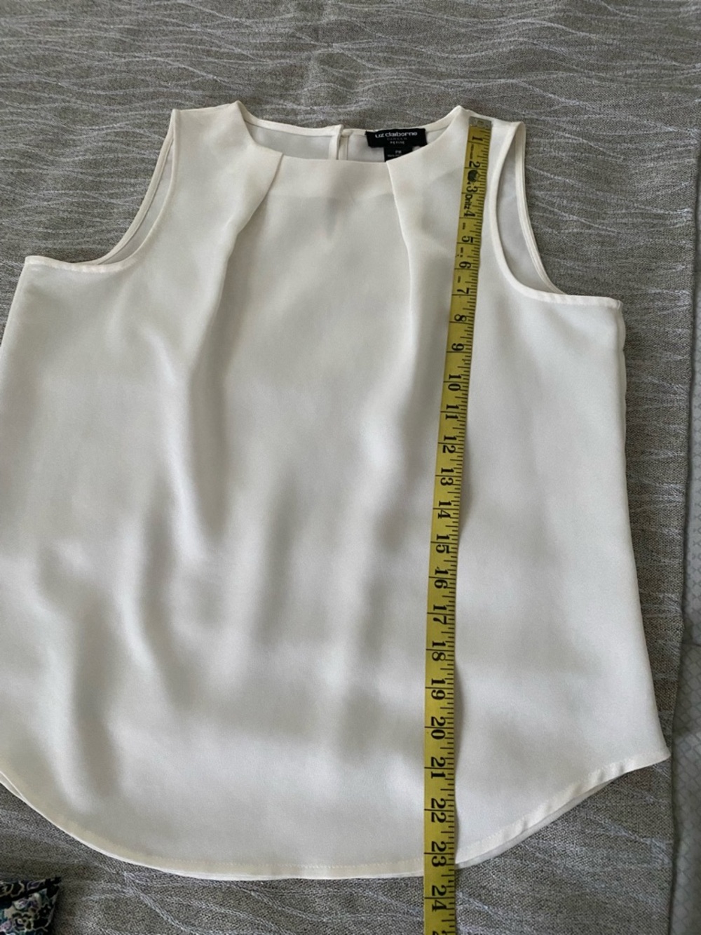 Sleeveless, almond color blouse